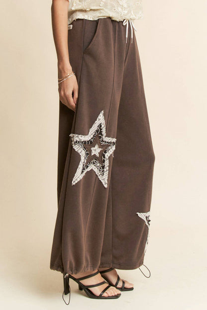 THE CURVY DENIM STAR PATCHWORK PANTS