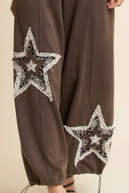 THE CURVY DENIM STAR PATCHWORK PANTS